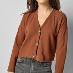 Front view of praline cotton waffle knit long sleeve cropped cardigan by Lilla P.

