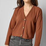 Front view of praline cotton waffle knit long sleeve cropped cardigan by Lilla P.

