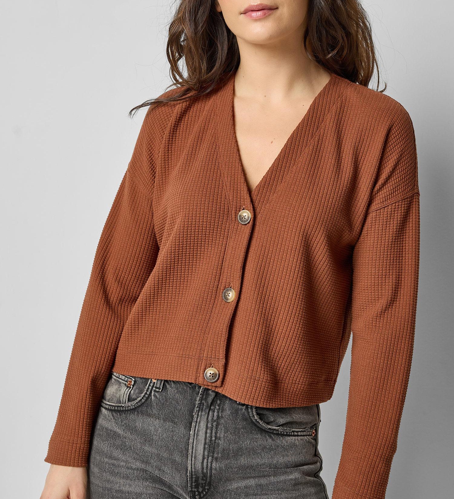 Front view of praline cotton waffle knit long sleeve cropped cardigan by Lilla P.

