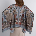 Back detail of hand-illustrated silk scarf blouse with botanical print and kitten motif from Sabina Savage collection