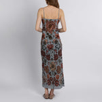 Back view of luxury silk slip dress featuring adjustable straps and floral botanical print
