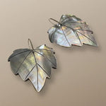 14k gold leaf drop earrings by Simon Alcantara with carved design and handwoven ear wires