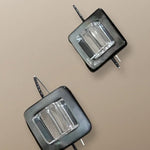 Mother of pearl and quartz drop earrings by Simon Alcantara in argentium silver with geometric design