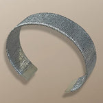 Handwoven sterling silver bracelet by Simon Alcantara with wide textured design